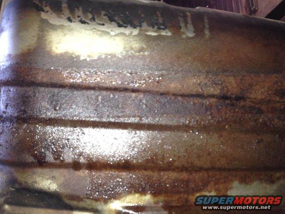 rusted metal part with horizontal ridges