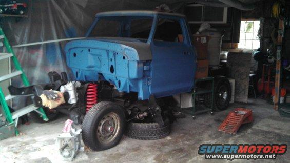 Blue 1977 Ford F-150 chassis with cab, front 3/4 view