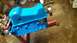 1977 Ford F-150 - A bright blue engine block is mounted on a red engine stand, likely awaiting installation or further work.