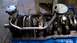 1977 Ford F-150 - Close-up of an engine block assembly, showing internal components like the crankshaft and oil pump.