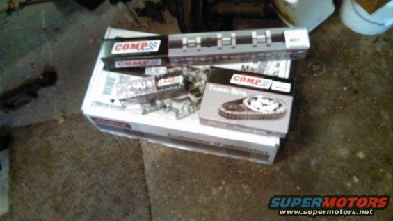 Several COMP Cams engine parts in boxes, including a timing set