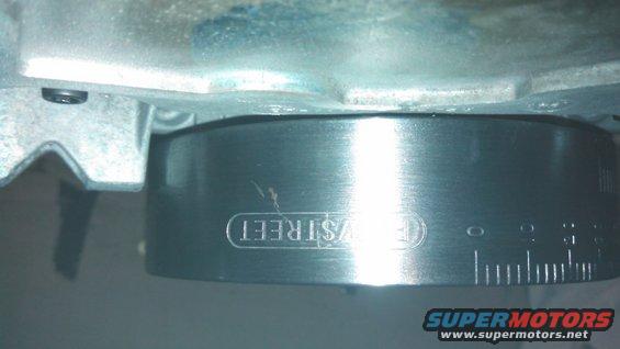 Engine part with 'EV STREET' stamped and measurement markings
