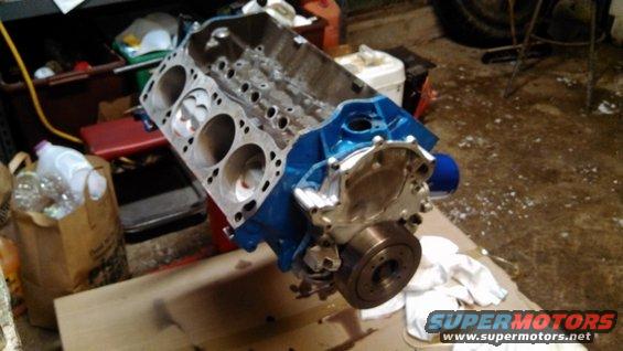 Blue engine block with pistons visible