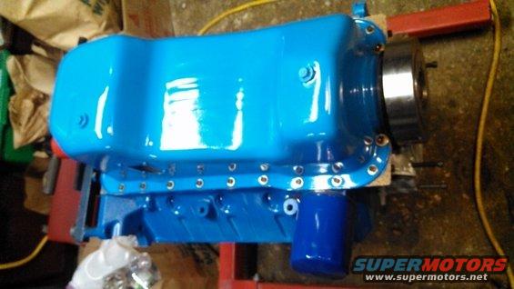 Blue painted engine oil pan with a blue oil filter attached