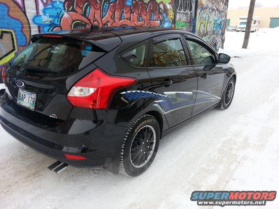 Black 2012 Ford Focus hatchback with blue graphics on the side