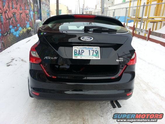 Rear view of black 2012 Ford Focus SE Sport hatchback with license plate BAP 179