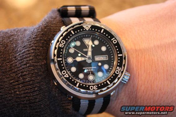 Seiko Professional 300m dive watch on a striped NATO strap on a wrist