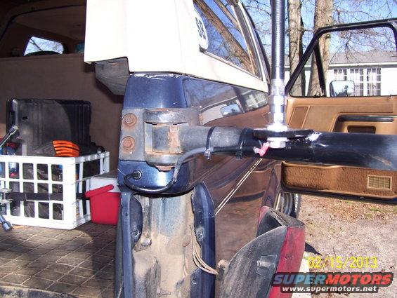 Inside of a vehicle showing a CB antenna mount attached to the door frame