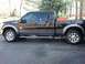 2011 Ford F-250 - Black 2011 Ford F-250 Super Duty pickup truck parked outdoors.