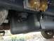 2011 Ford F-250 - The underside of a truck reveals its fuel system components, including filters and tank, with a tire visible.