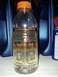 2011 Ford F-250 - A clear bottle shows separation of fluids, with a layer of amber liquid above a clearer liquid, possibly indicating contamination or settli…