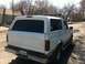 1994 Ford Bronco - This white Ford Bronco, viewed from the rear, appears to be from the early to mid-1990s, not a 1994 model.