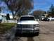 1994 Ford Bronco - Front view of a white 1994 Ford Bronco, equipped with a chrome grille guard and auxiliary lights on the roof.