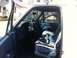 1994 Ford Bronco - Interior view of a 1994 Ford Bronco, blue upholstery and striped seat covers.