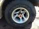 1994 Ford Bronco - A close-up view of a tire and wheel assembly, showing the Goodyear Wrangler branding.
