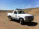 1994 Ford Bronco - This 1994 Ford Bronco is shown in a three-quarter front view, equipped with a roof-mounted light bar and a front brush guard.