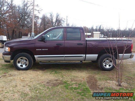 Maroon 2004 Dodge Ram 1500 pickup truck, side view