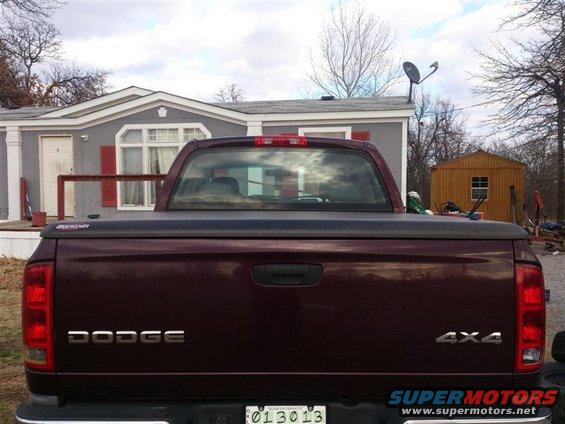 2004 Dodge 1500 pickup truck rear with 'DODGE' and '4X4' badges. License plate reads 013013