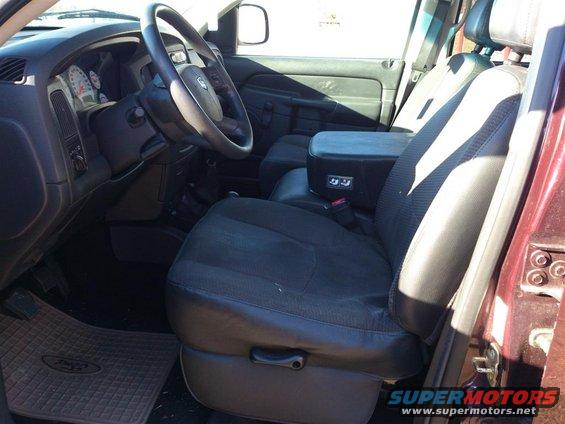 Interior view of a 2004 Dodge 1500 showing the driver's seat, dashboard, and center console