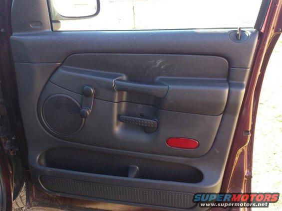 2004 Dodge 1500 interior door panel with speaker, window crank, and door handle
