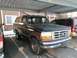 1992 Ford Bronco - This 1992 Ford Bronco is parked under a carport next to another vehicle.