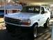 1992 Ford Bronco - White 1992 Ford Bronco with some paint chips on the hood.