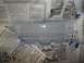 1990 Ford Bronco - Newspaper protects a vehicle part during a painting or repair process.