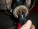1990 Ford Bronco - Using snap ring pliers on a vehicle's brake drum and hub assembly.