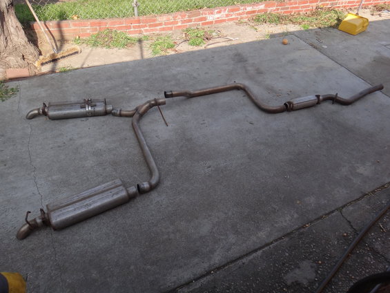 Exhaust system laid out on concrete