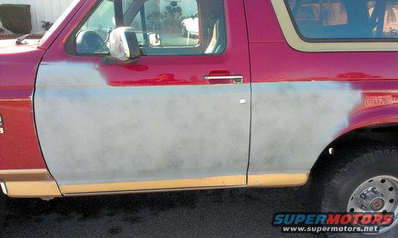 1994 Ford Bronco side panel with primer and red paint