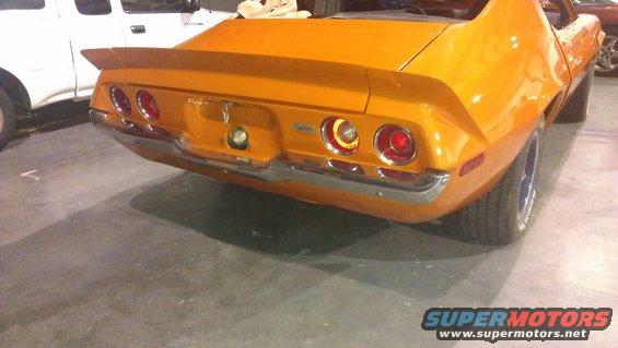Orange 1973 Chevrolet Camaro rear view with spoiler and chrome bumper