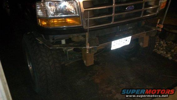 Front view of a 1992 Ford F-Series truck with a custom metal bumper and large tires