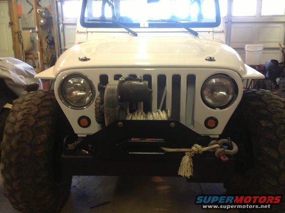 White 2000 Jeep TJ front view with winch and large tires