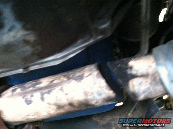 072.jpg The PO had wrapped sheet metal to the exhaust to stop the leak. Held it on there with some exhaust clamps.