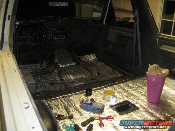 1989 Ford Bronco interior showing sound deadening material on the floor and dashboard