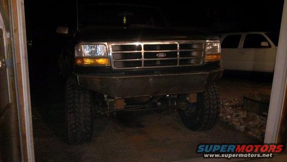 Front view of black 1995 Ford Bronco with custom bumper and large tires