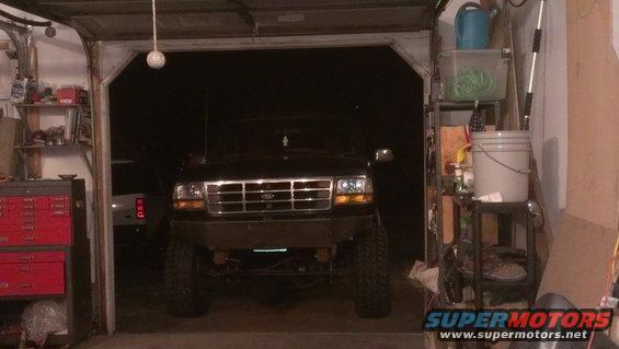 1995 Ford Bronco front view in a garage with a custom bumper