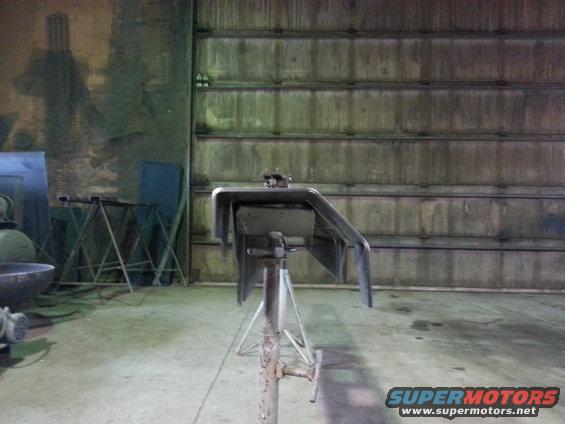 Vehicle part on stand in workshop