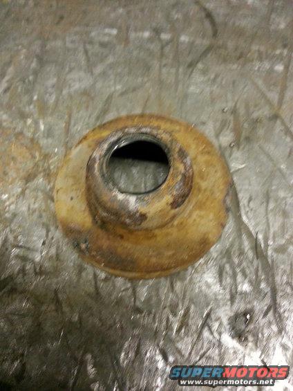 Rusty metal part with a circular opening