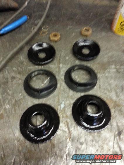 Spring isolators and nuts on a workbench