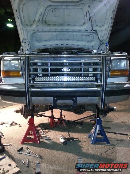 1994 Ford Bronco front end on jack stands with bull bar and LED light bar