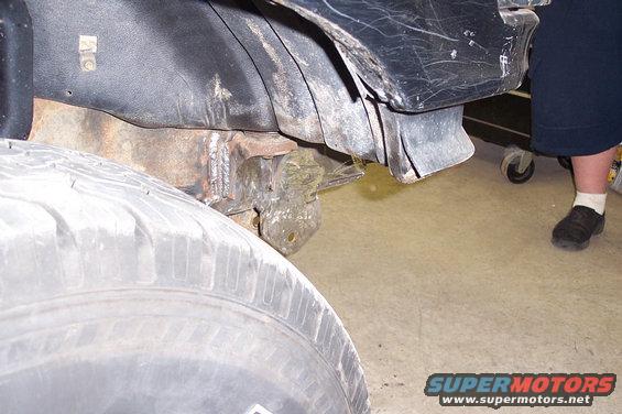 Close-up of a vehicle's wheel well and suspension components
