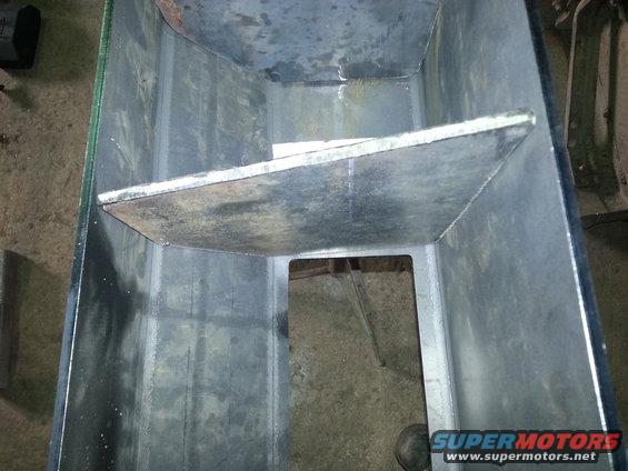 Inside view of a custom metal box with a shelf and cutout