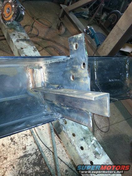 Welded metal frame with bracket and holes