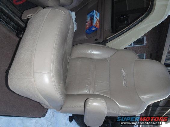 Tan leather driver's seat with 'Limited' stitched on the side, seen from the passenger side