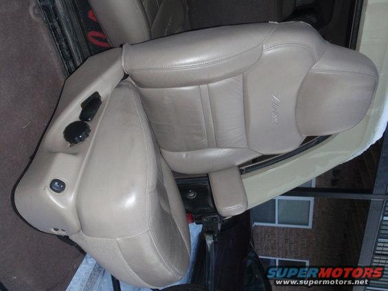 Tan leather seats with embossed 'Eddie Bauer' script