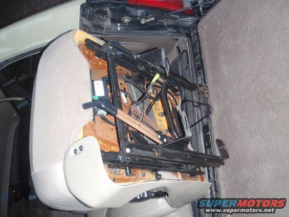removed car seat mechanism with exposed springs and wiring