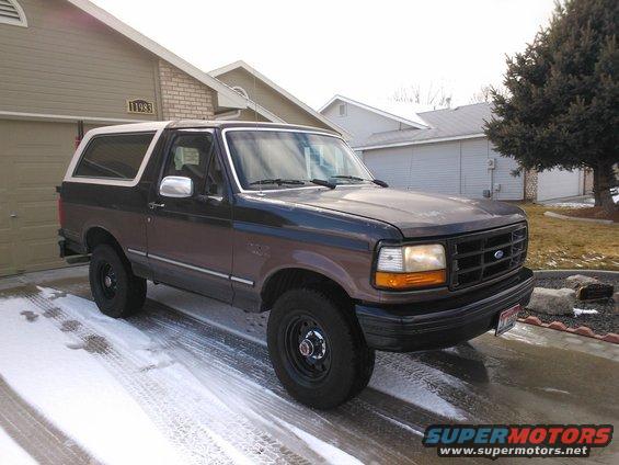 1992 Ford Bronco parked in driveway with snow on the ground