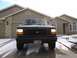 1992 Ford Bronco - This Ford F-150 truck, likely from the early to mid-1990s, is parked in front of a suburban house.