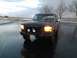 1992 Ford Bronco - A 1992 Ford Bronco is seen from the front on a wet, overcast day.